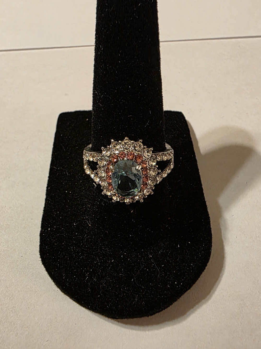 Blue Crystal Halo Cocktail Ring with Rose Accent Stones